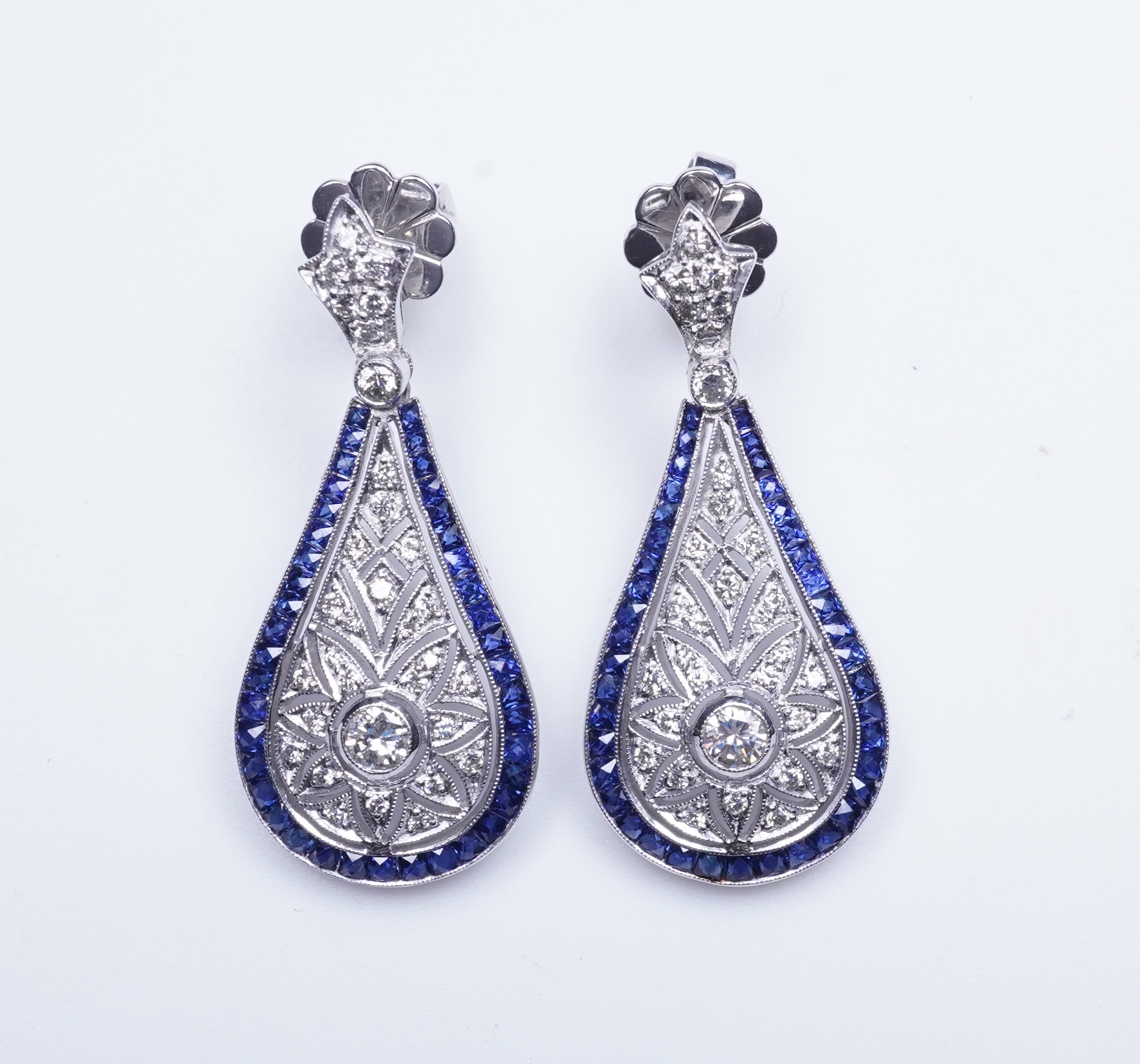 A pair of sapphire and diamond earrings